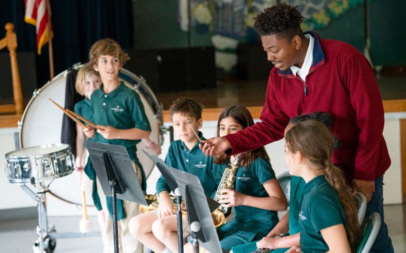 Music teacher leading students