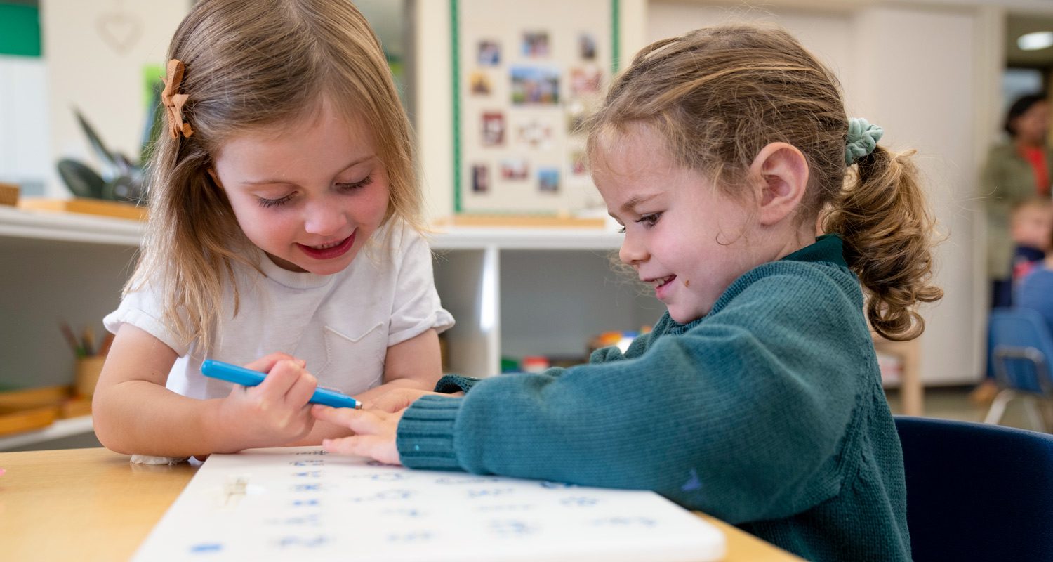 Two young Montessori students