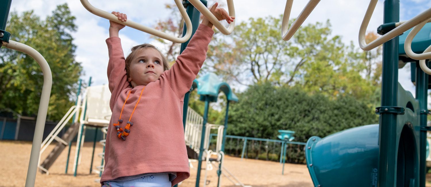 Student playing on playground