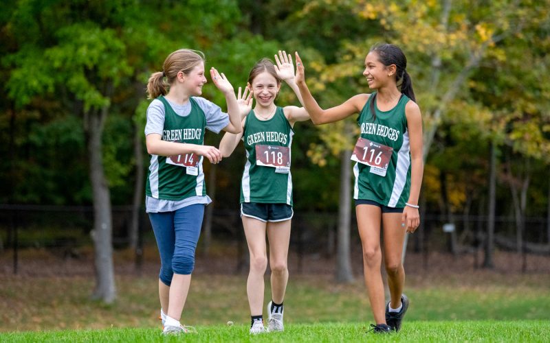 Three girls running track